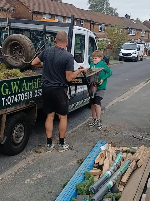 Georgie working with Gary on an artificial grass job