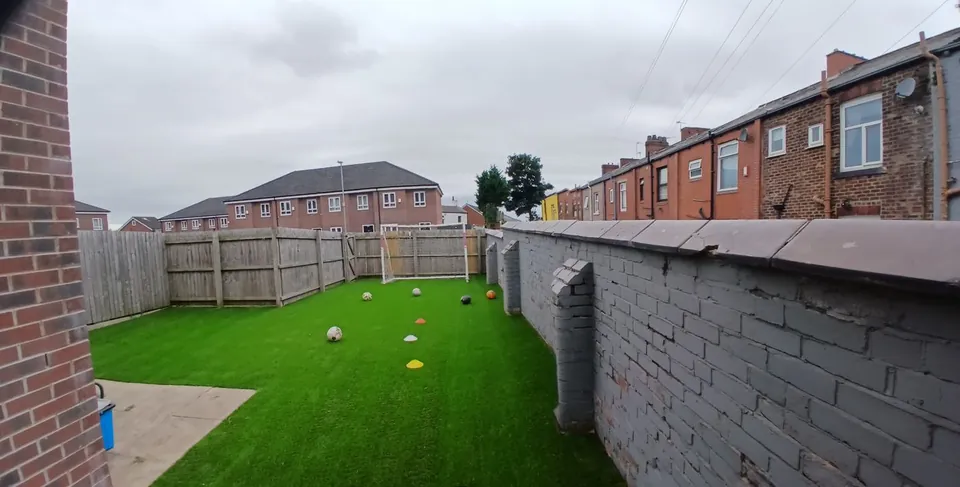 Mini football pitch artificial grass installation
