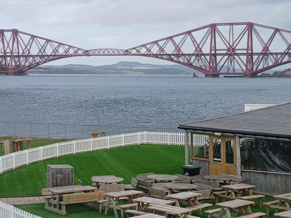 Artificial grass outdoor seating area at Scott’s Bar in South Queensferry overlooking the Forth Bridge