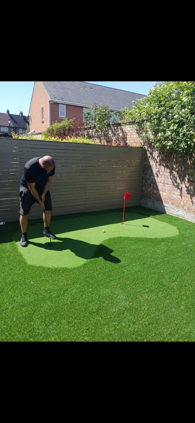 Putting practice on a completed garden putting green.