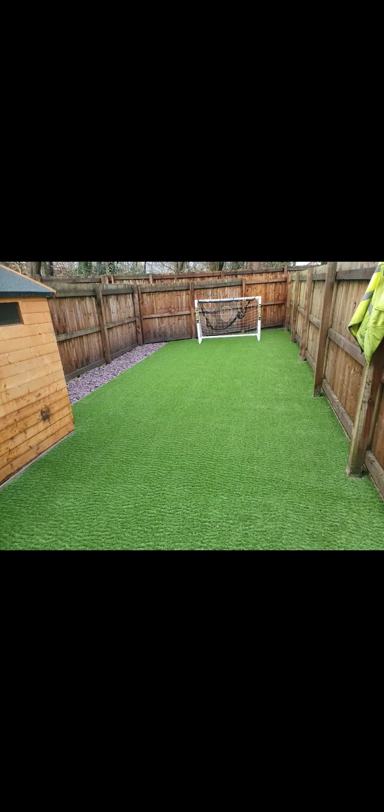 A compact artificial grass football practice garden.